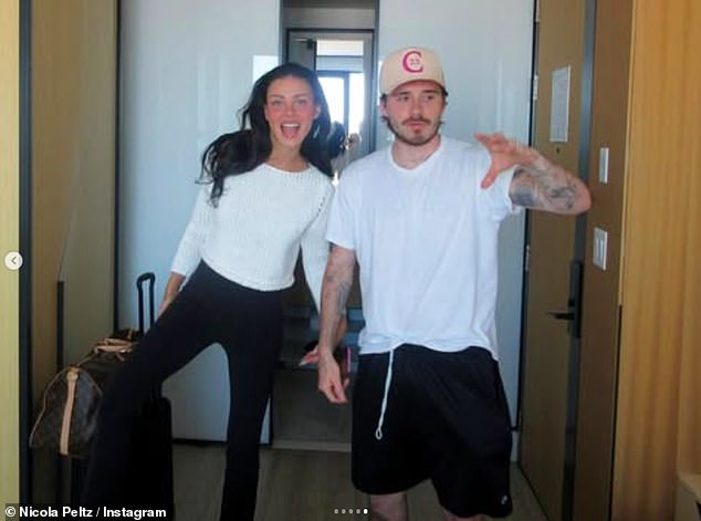 The heiress cosied up to her hunky husband as they playfully posed for the camera