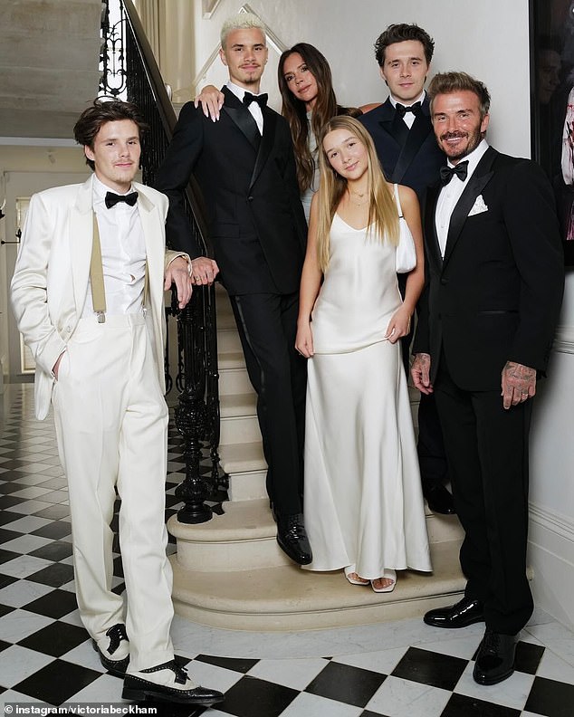 David and Victoria seen wit their children last year before feud