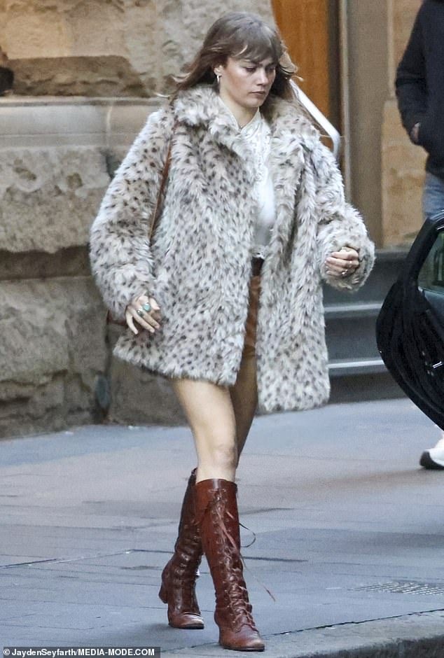 She also put on quite the leggy display in a pair of light brown hotpants that finished at the top of her thigh