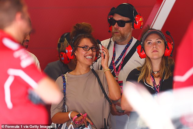 She couldn't contain her smile as she watched the drivers practice ahead of the F1 Grand Prix of Great Britain at Silverstone Circuit