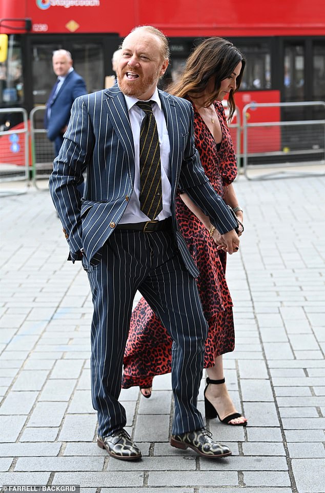 Leigh Francis dressed up in a navy pinstripe suit as he rocked up with wife Jill Carter