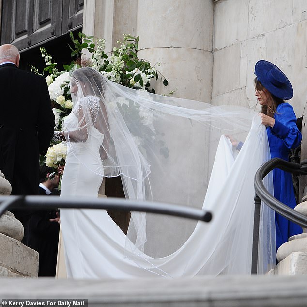 While Cookie was adorable - she couldn't upstage blushing bride Mel B - who looked incredible in a pearl-adorned white gown as she arrived.