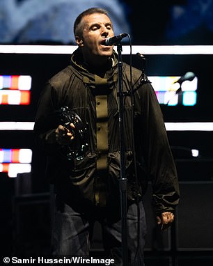 On Saturday night, Noel, 58, and brother Liam, 52, continued their display of unity as they held hands during their entrance (Liam Gallagher pictured on stage)