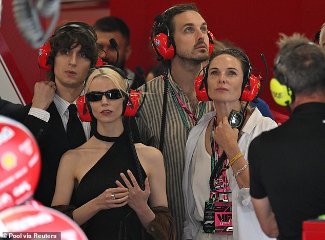 She was later seen with husband Rory St. Clair Gainer, actress Anya Taylor-Joy and her musician husband Malcolm McRae in the Ferrari garage
