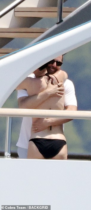He enveloped her in a tight hug