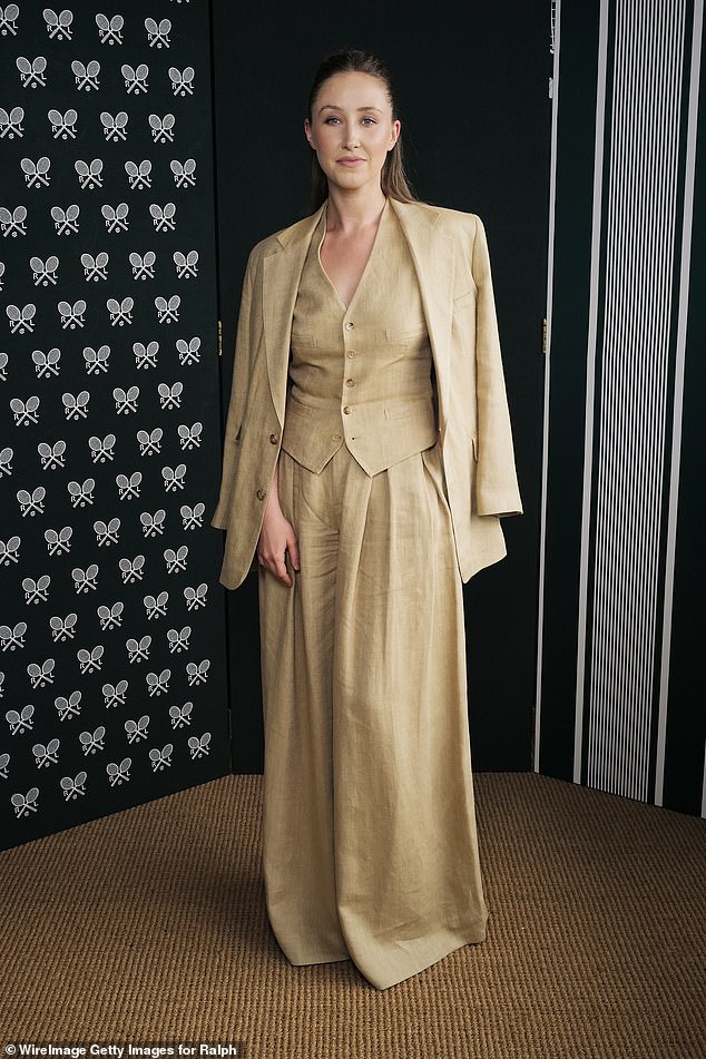 Erin looked effortlessly stylish in a Ralph Lauren suit which boasted wide legged trousers and a waistcoat that she opted to go shirtless beneath