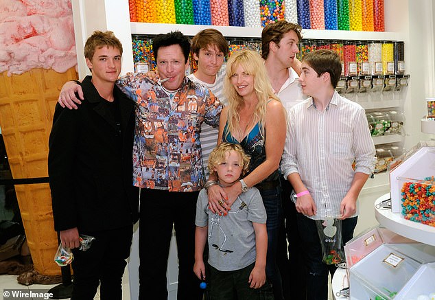 Luke, one of the three sons the actor welcomed with wife DeAnna, took to Instagram to laud his father and 'tell Hudson I said hi' following his death; Hudson is pictured left, Luke front, with his brothers and mom DeAnna