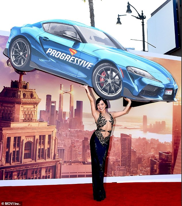 The actress had fun posing with a Progressive stamped car