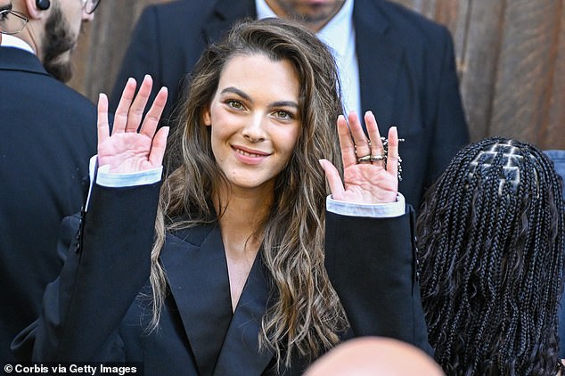 Vittoria Ceretti offered a polite wave a she prepared for the Balenciaga show on Wednesday