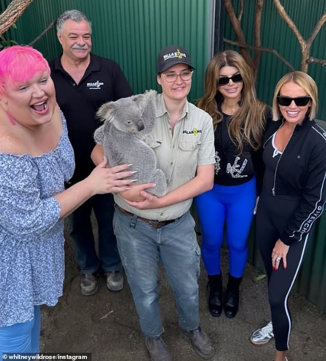 Whitney later on posted a picture to Instagram of the pair posing with a koala at Billabong Zoo in Port Macquarie, however both maintained their distance in the snap