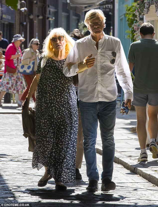 Judy, 77, looked happy and healthy as she wore a long navy and white patterned dress and black shoes