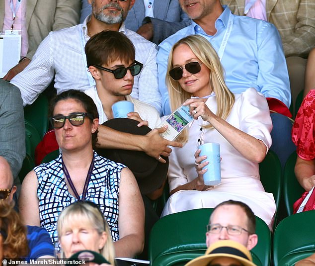 The mother-son duo got their drinks in hand ready to watch the match