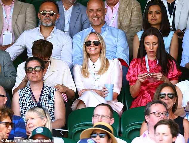 Emma looked radiant and glowing as she watched the action on Centre Court