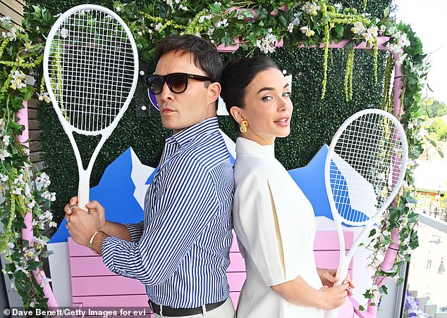 The couple larked around with tennis rackets