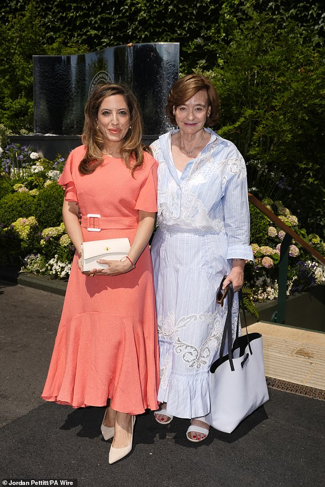 Cherie Blair (right) wore a pale blue shirt dress with lace detailing