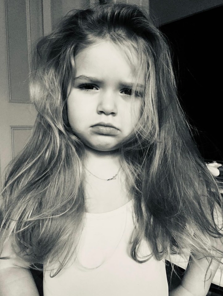 Black and white photo of Harper Seven Beckham looking unhappy.