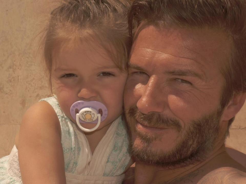 David Beckham with his young daughter.