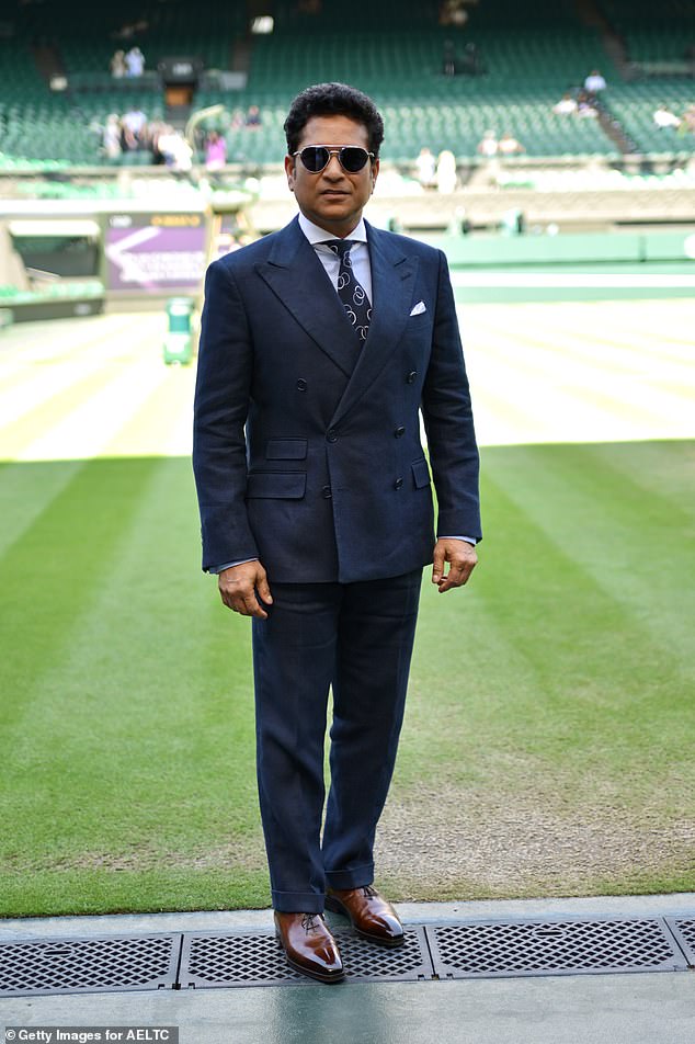 Indian former international cricketer Sachin Tendulkar looked very smart in a navy suit and brown shoes