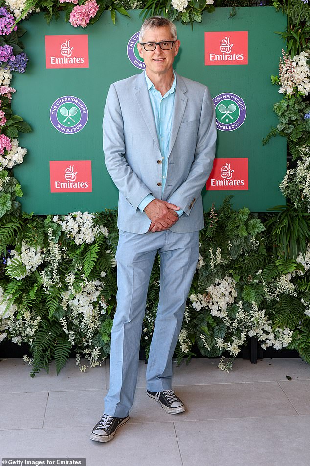 Louis Theroux opted for a pale grey jacket and blue trousers before completing the look with black Converse