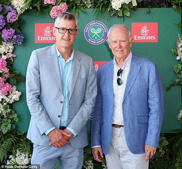 Louis Theroux opted for a pale grey jacket and blue trousers as he posed in the Emirates suite alongside the company's president Sir Tim Clark