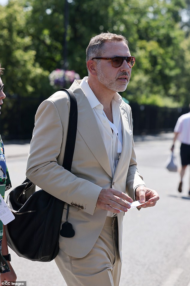 David Walliams opted for an all beige look as he arrived with a large black shoulder bag