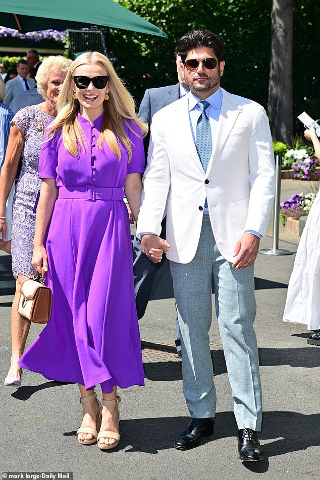 Katherine Jenkins made sure to catch eyes in a stunning bright purple button up summer dress as she walked hand in hand with her husband Andrew Levitas
