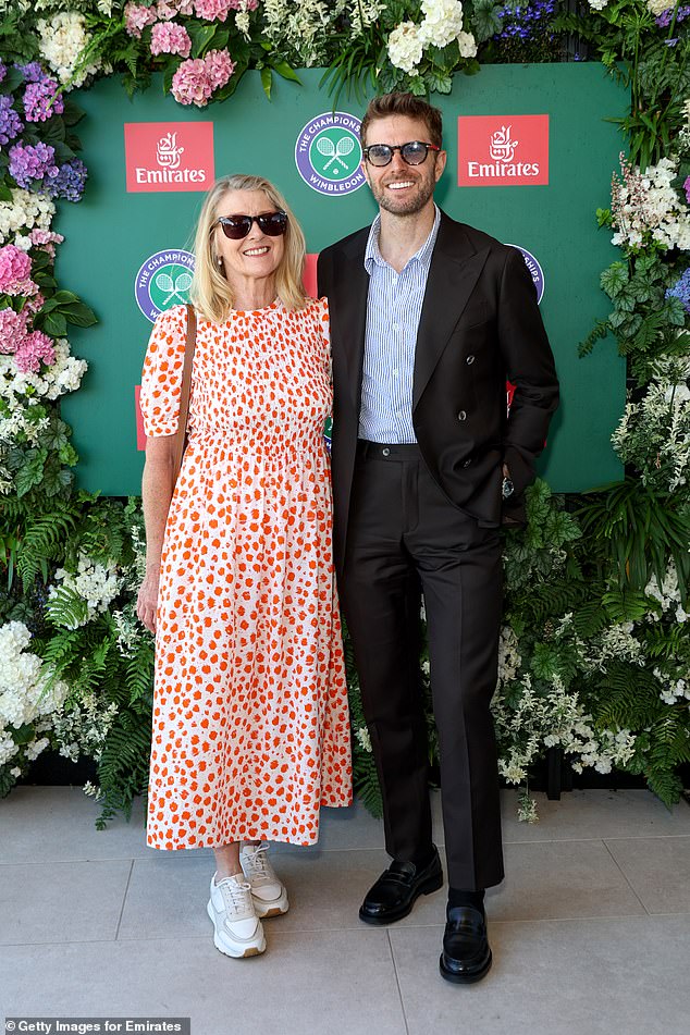 Joel was joined by his mum Penny who wowed in a red floral dress