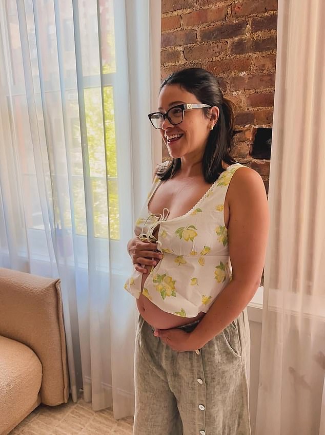 The following day, she took to Instagram to share another snap of herself in pajamas, cradling her bump