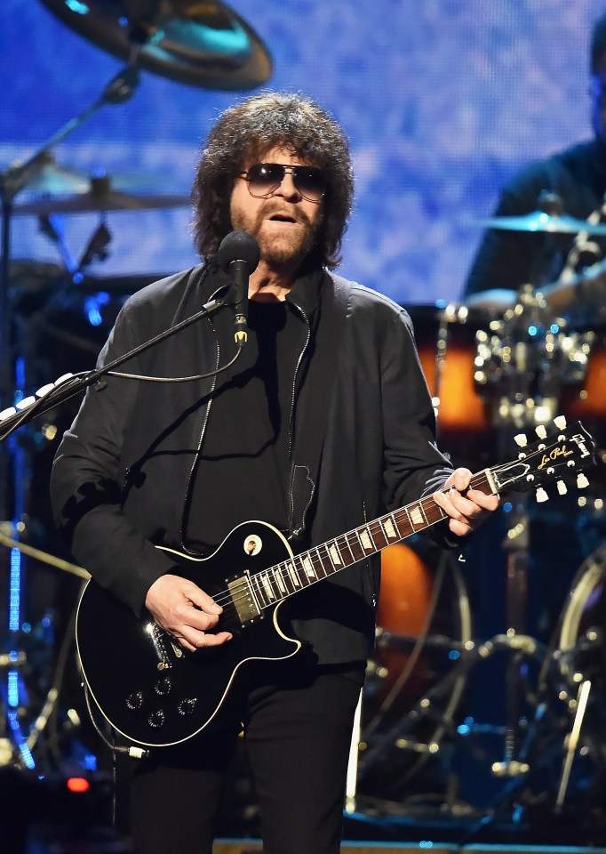 ELO inductee performing onstage with a guitar.