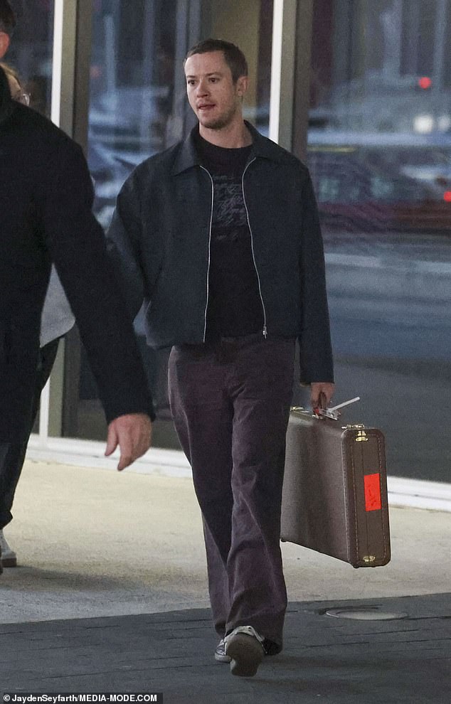 The British heartthrob looked stylish and unbothered as he strolled through the terminal in Adidas sneakers