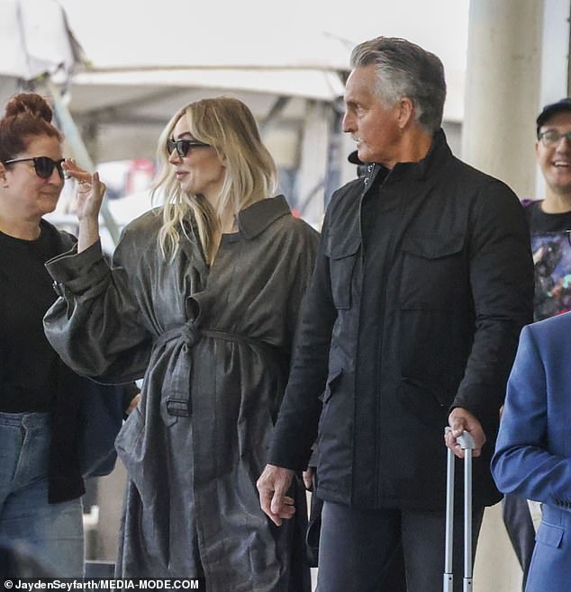The Crown actress shielded her eyes with oversized black sunglasses and carried a sleek black Hermès handbag