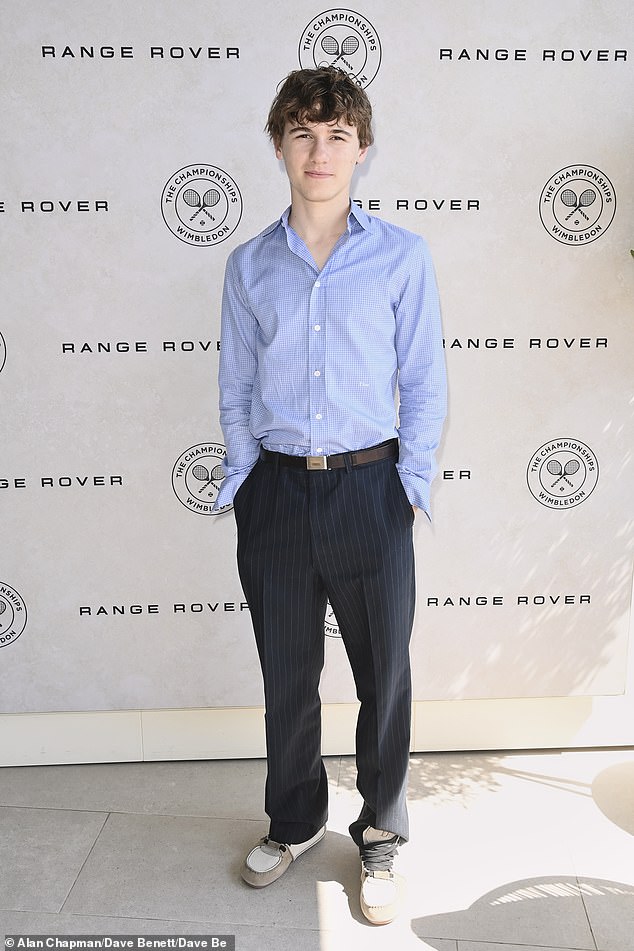Sam Nivola opted for a blue shirt, black pinstripe trousers and quirky trainers