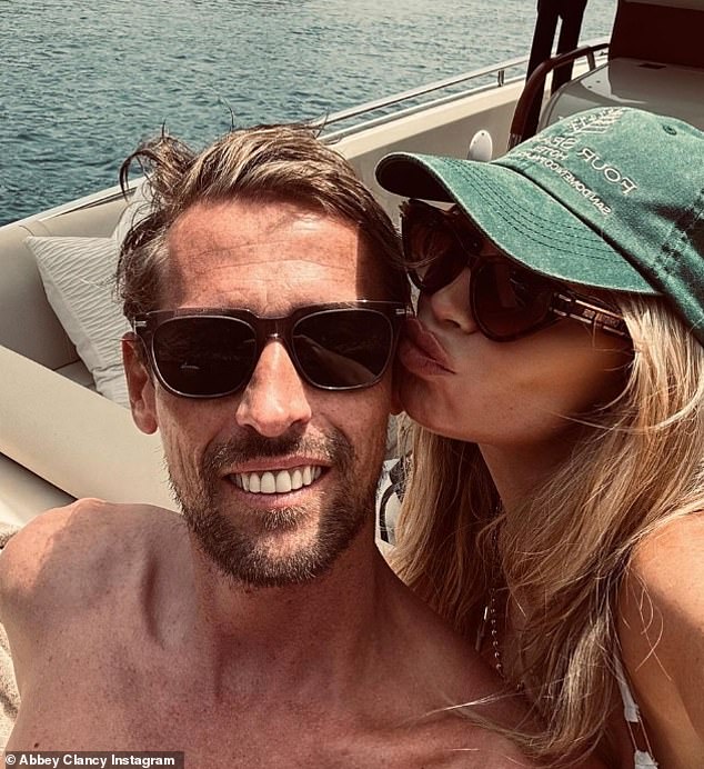 The TV presenter, 43, looked happier than ever as she posed for a selfie with her WAG pal, 39, whose husband is football legend Peter
