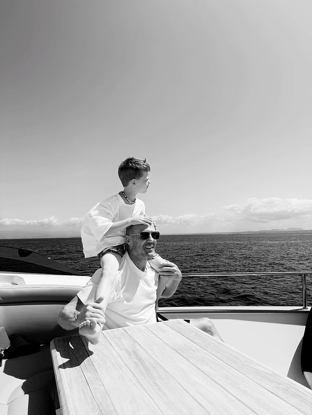 A heart-melting picture of the actor saw him holding son Jack on his shoulders as he beamed happily