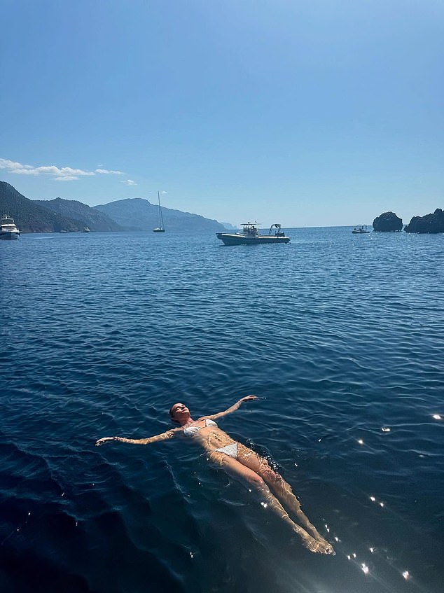 She flashed a glimpse of her incredibly toned frame while swimming in the crystalline waters