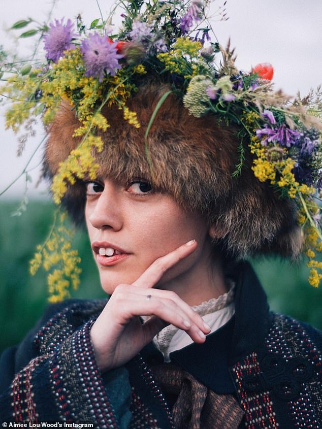 She even wore a Russian bear hat topped with flowers in another behind the scenes look