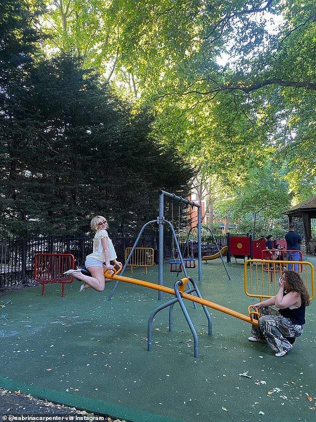 Carpenter shared a playful snap as she and a friend sat on a teeter-totter at a kiddie park. The hitmaker looked carefree wearing a pair of striped short-shorts with a loose-fitting yellow top and high-heel mules