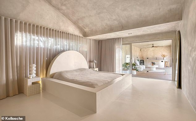 The home, known as the marble mansion, features soaring ceilings and curved archways