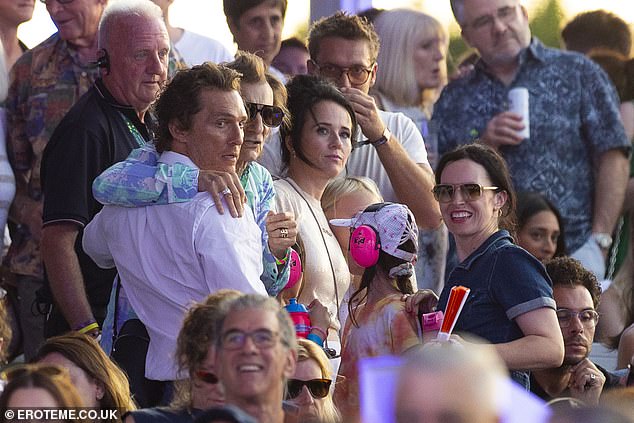 One photograph showed actor Matthew - who also caught attention at Wimbledon in recent days - sharing an embrace with Rolling Stones star Ronnie, 78