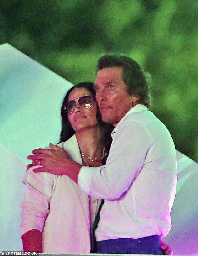 They couldn't keep their hands off one another as they shared a close embrace while the music played