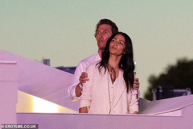 The pair were seen happily smiling and throwing their arms around one another as they socialised in the crowds, before watching the set from the VIP area