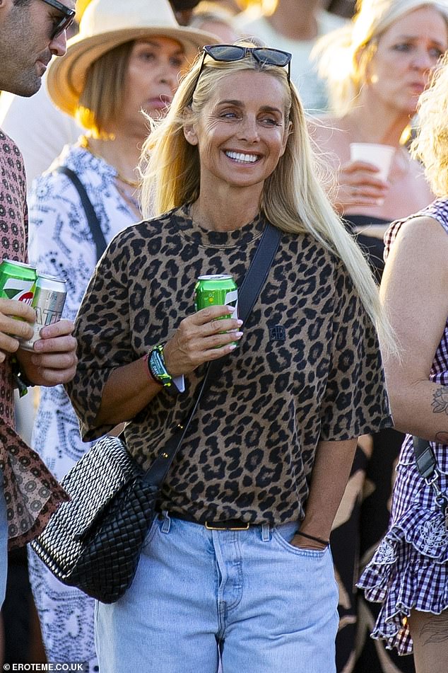 Louise, 50, put on a stylish display in washed-out denim jeans and a leopard print T-shirt as she joined other concertgoers in the crowds