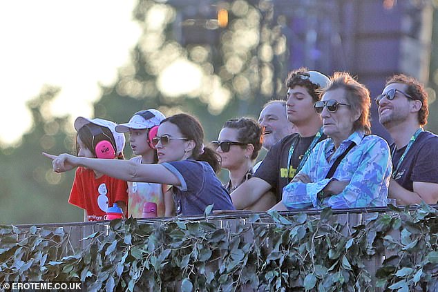 Sally was every inch the doting mother as she stood beside her daughters in the VIP section