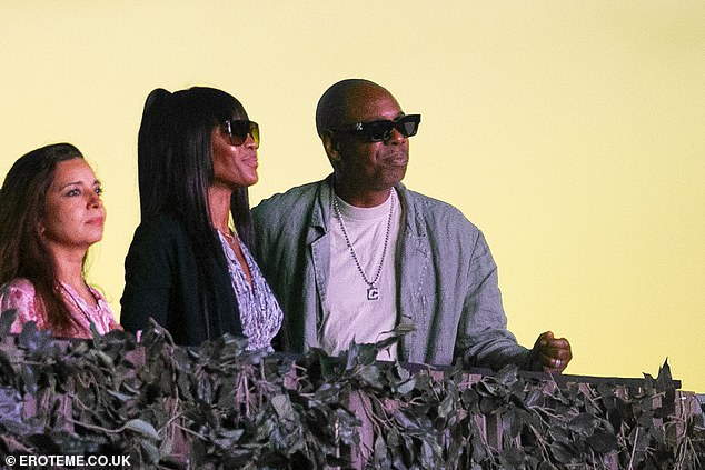 Naomi flashed a smile as she joined Dave Chappelle to watch Stevie's headlining set