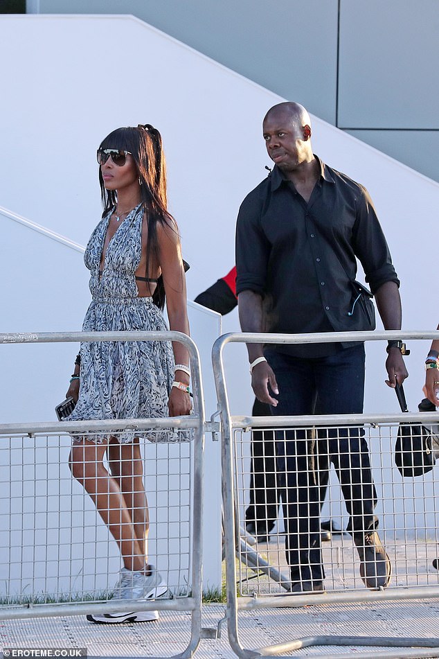 She kept comfortable in a pair of silver trainers and shielded her eyes with aviator shades