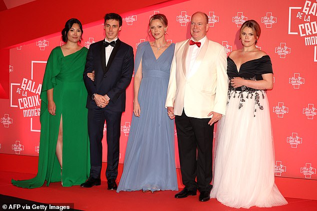 Son of Stephanie of Monaco, Louis Ducruet (2nd L) and his wife Marie Chevallier (L), Prince Albert II of Monaco (2R), Princess Charlene of Monaco (C) and Daughter of Stephanie of Monaco, Camille Gottlieb pose as they arrive to attend the 76th annual Monaco Red Cross Ball