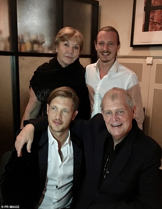 Last August, his father John revealed he was cancer-free 12 months after having mouth surgery. Pictured with his wife Jill and his sons Rob and James
