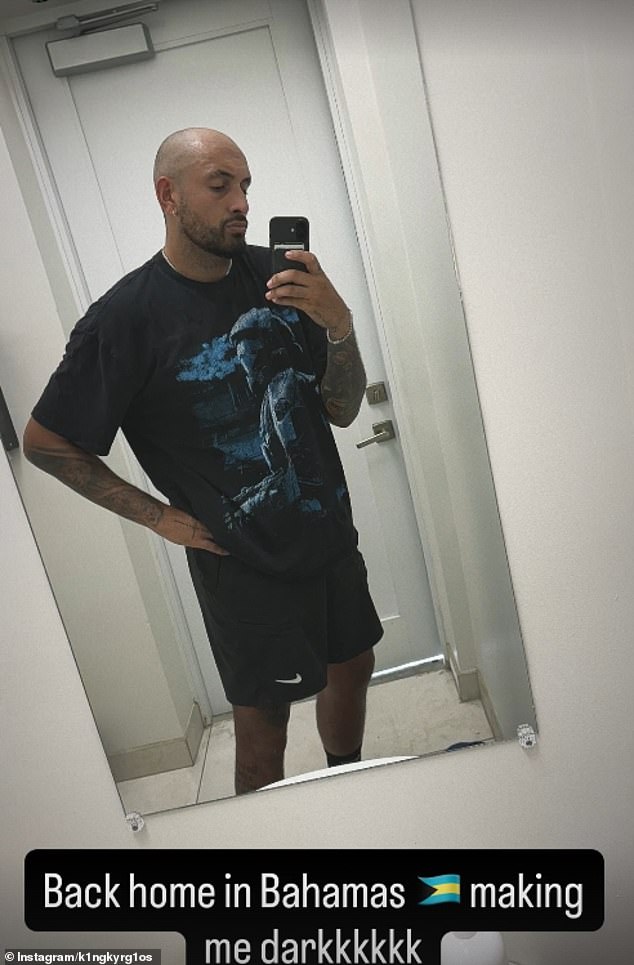 Nick also shared a second photo, this time a mirror selfie, that showed him looking pensive as he posed. 'Back home in the Bahamas. Making me darkkkkkk,' he wrote,