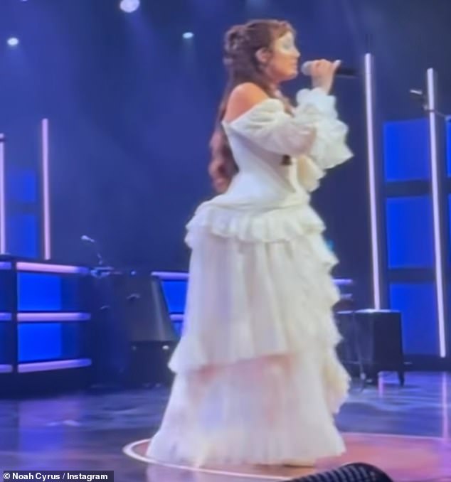 In photos and videos she posted from her gig, she was the image of a retro country star in a white lace frock with tiered skirts, her lush curls cascading down her back