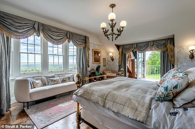 On the first floor are five bedrooms, while the main bedroom has a dressing room with French doors opening to a balcony and an ensuite bathroom